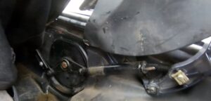Interior view of the Porsche convertible soft-top mechanical compartment, showing the Boomerang Arm, Clamshell Support Strut, and surrounding linkages in the service position.